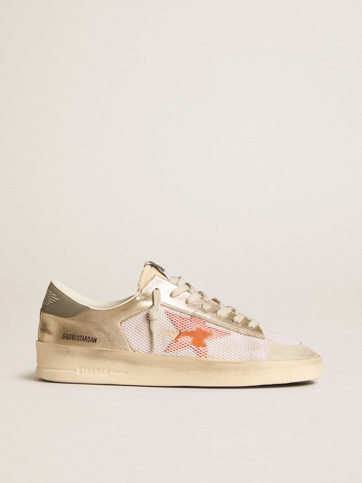 Stardan in white mesh with orange star and platinum leather details