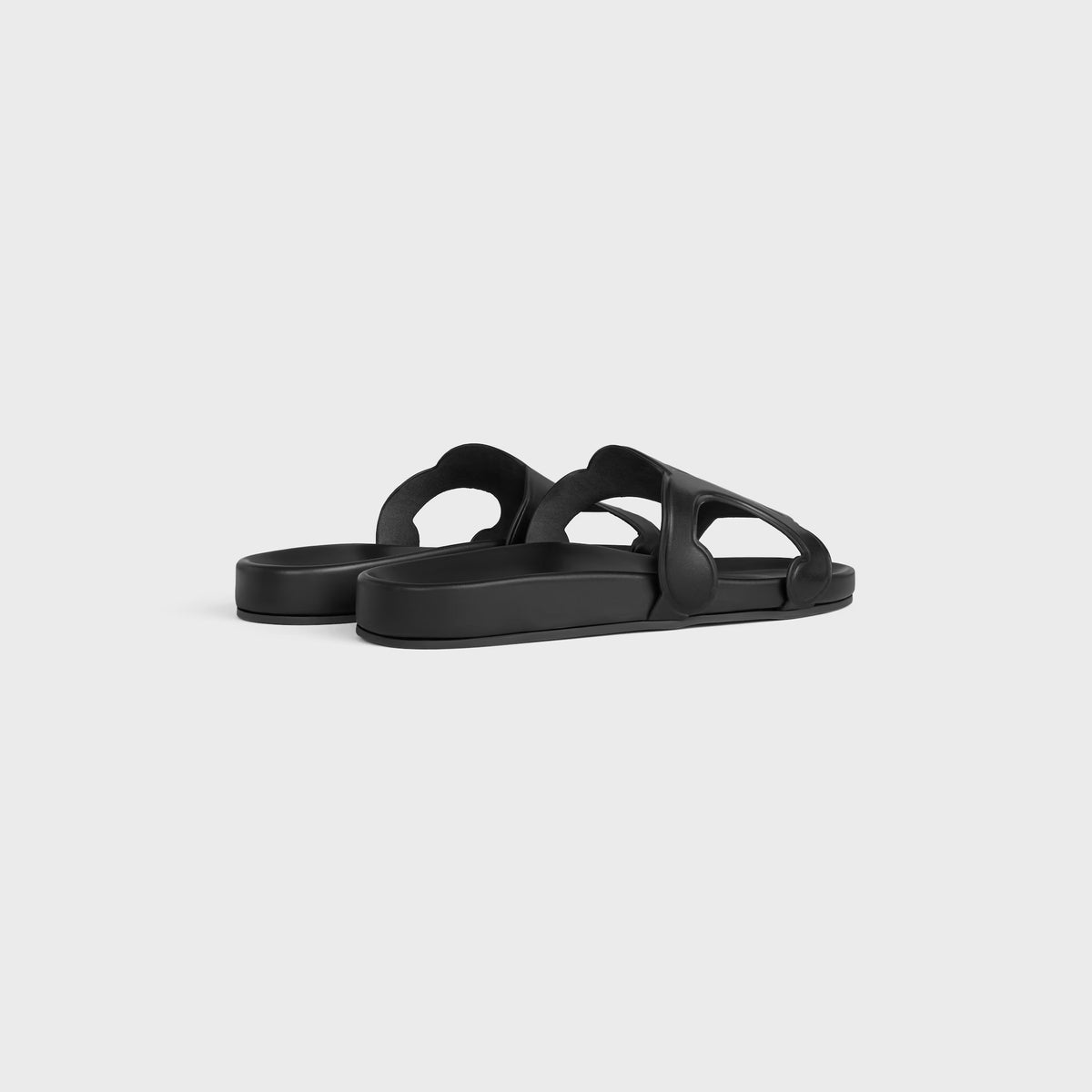 Triomphe slides in vegetable-tanned calfskin in Black