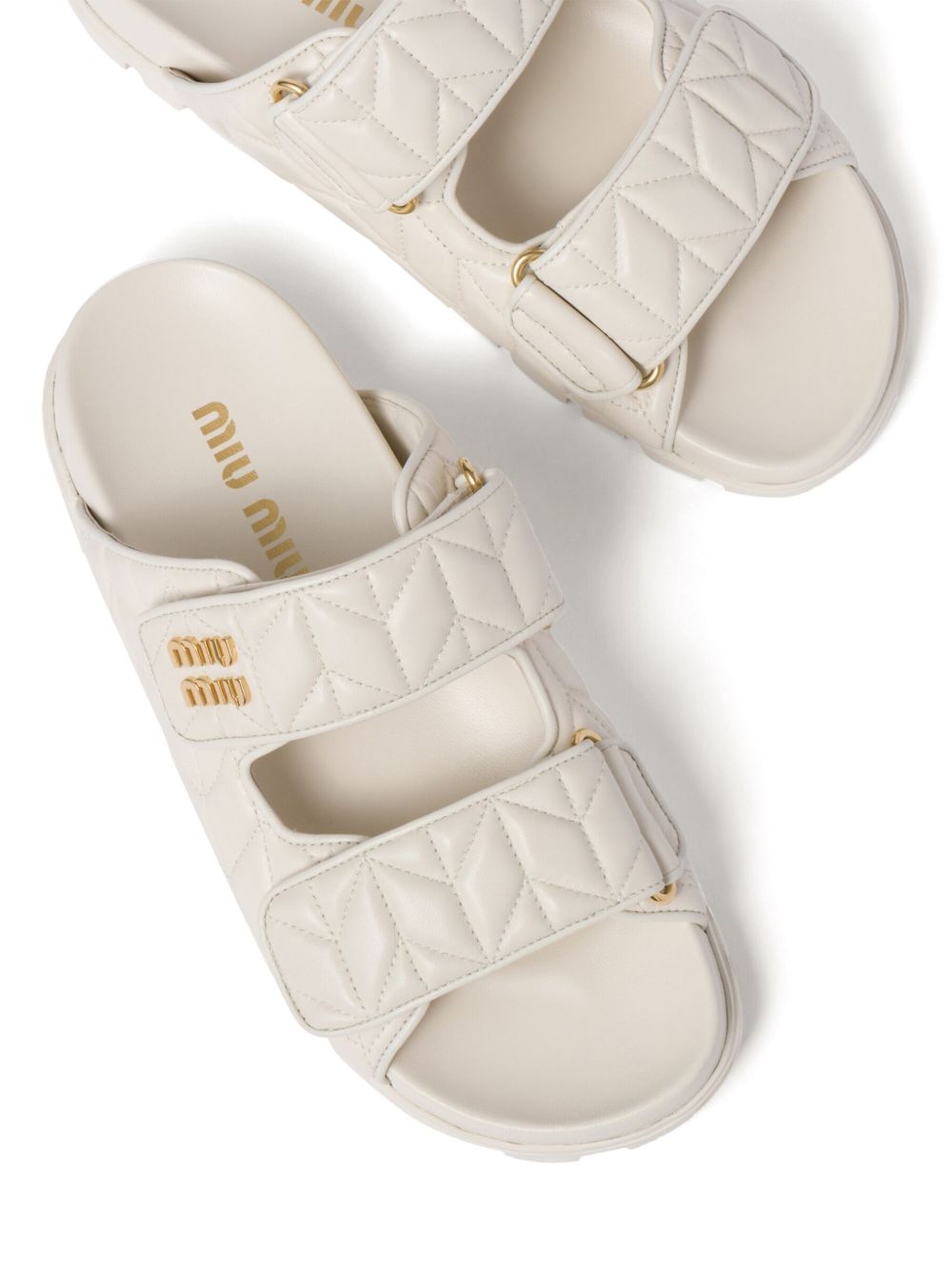 Padded slides made of white nappa leather