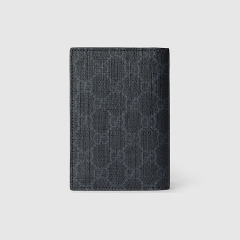 GG passport cover with grey lining made of black GG Supreme fabric
