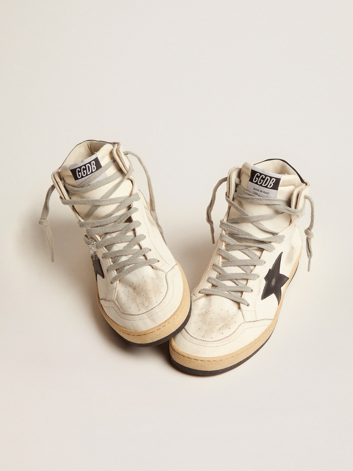 Sky-Star made of white leather with black leather star