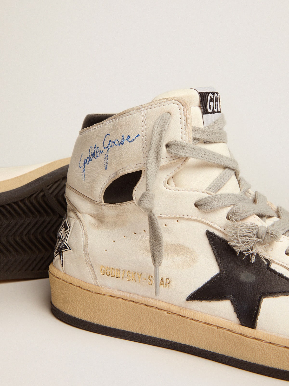 Sky-Star made of white leather with black leather star