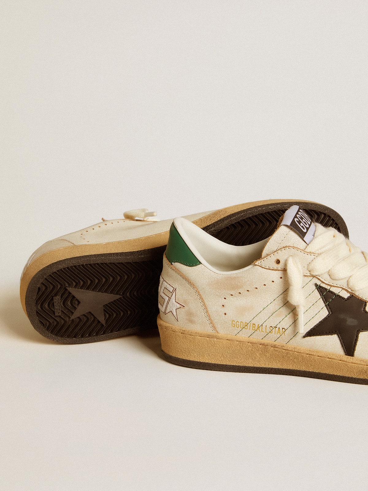 Black leather star and green leather on the heel