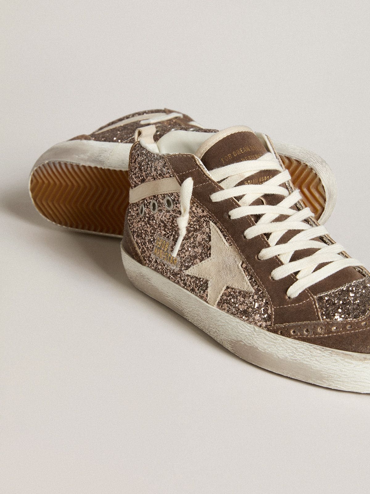 Glitter mid-star with pearl-colored suede star and brown suede inserts