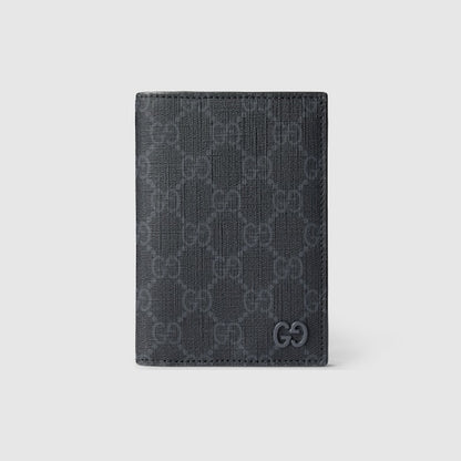 GG passport cover with grey lining made of black GG Supreme fabric