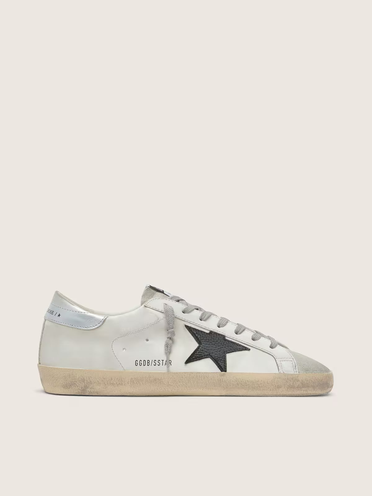 White leather with a black nubuck leather star and silver metallic leather heel
