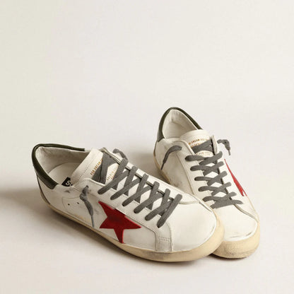 Red suede star and green leather on the heel