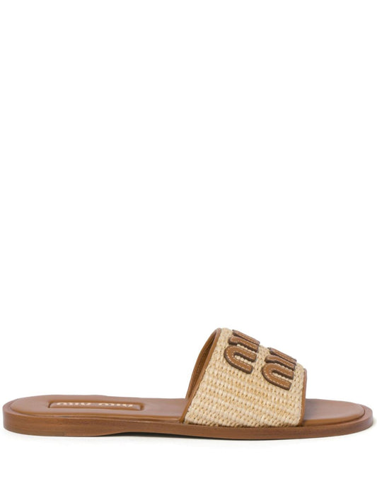 Logo sandals made of raffia in beige