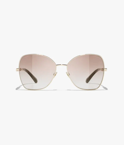 Butterfly-Sonnenbrille mit hellgoldfarbenem Metallgestell und beige verlaufenden Gläsern