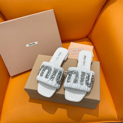Sandals in quilted white leather embellished with crystals