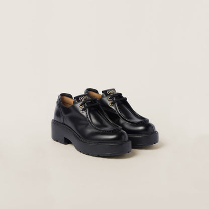 Leather lace-up shoes in black