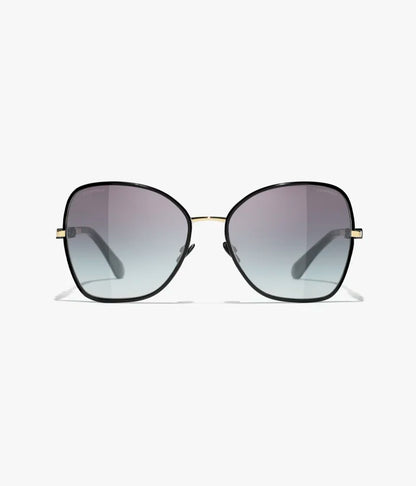 Butterfly-Sonnenbrille mit gold- und schwarzfarbenem Metallgestell und grau verlaufenden Gläsern