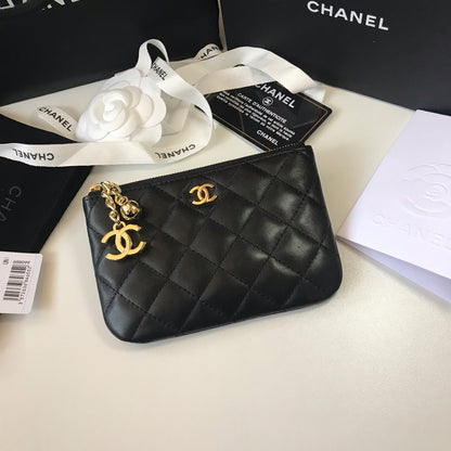Quilted black leather coin purse with CC logo and gold-tone metal details