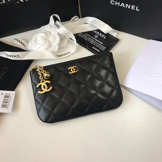 Quilted black leather coin purse with CC logo and gold-tone metal details