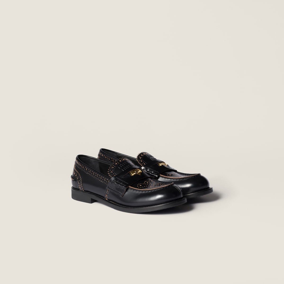 Leather loafers in black with gold-colored coin detail