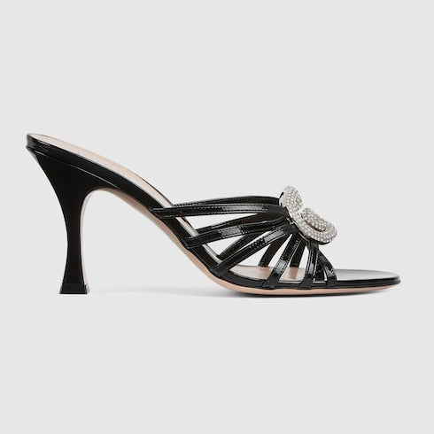 Women's heeled slider sandals with GG crystal-embellished cross straps in black patent leather