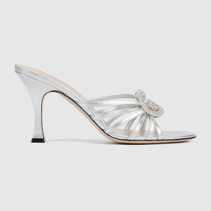 Women's heeled slider sandals with GG criss-cross straps and crystals in silver leather