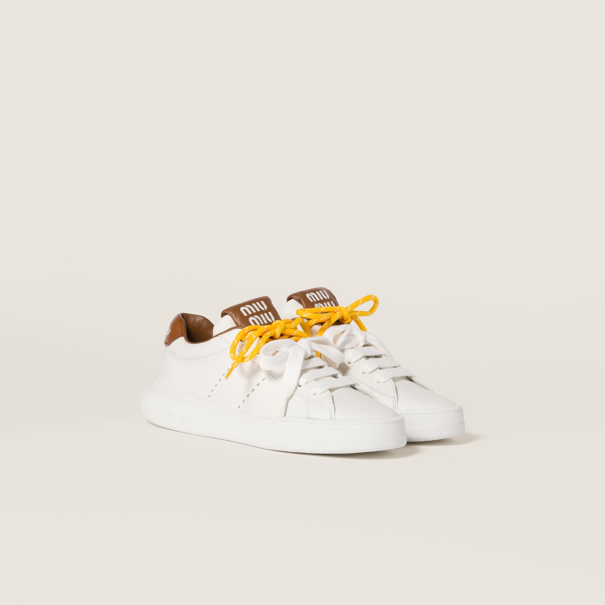 Sneakers aus Leder in Weiß/Braun
