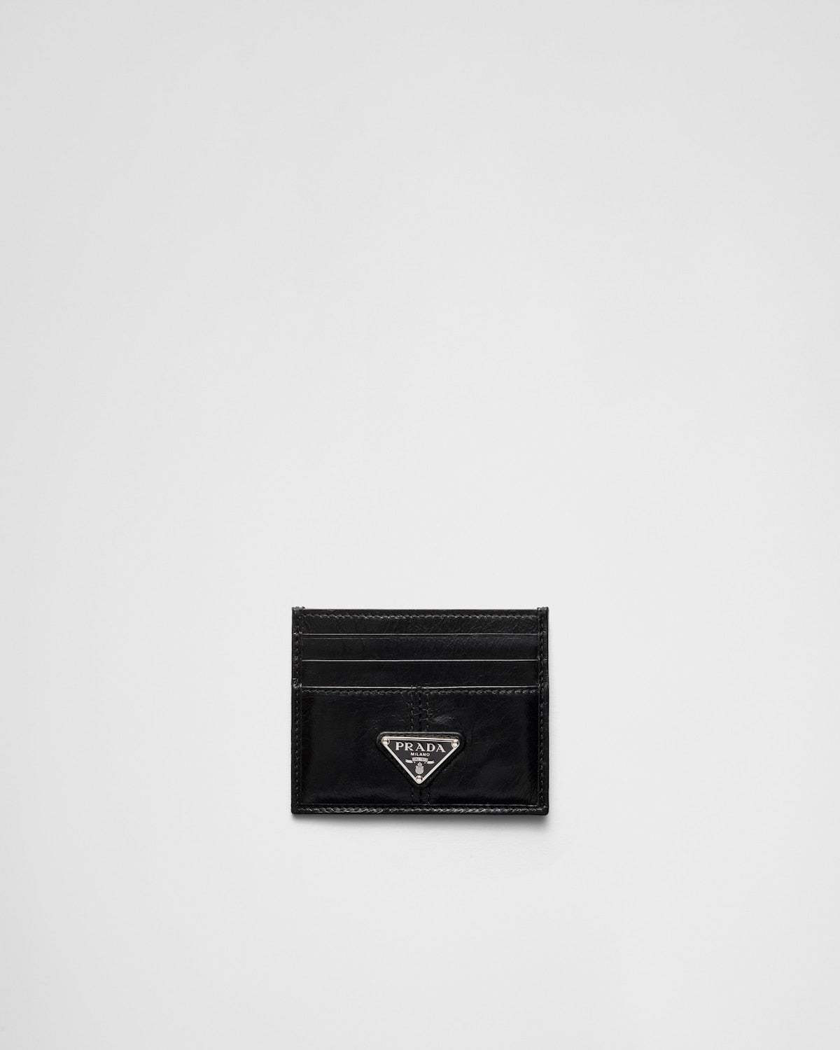 Black leather card holder with triangular logo