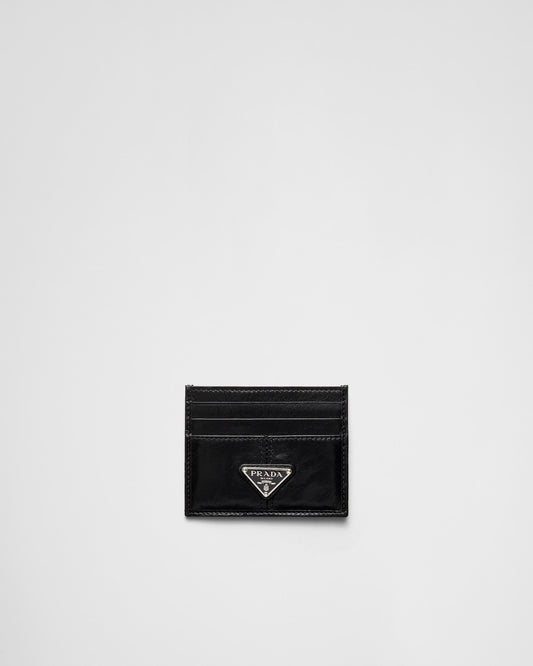 Black leather card holder with triangular logo
