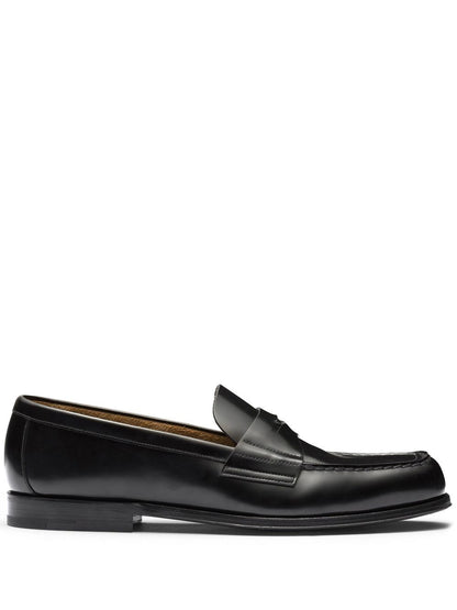 Black leather slipper with logo and plate