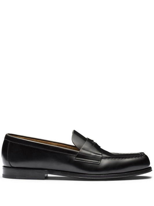 Black leather slipper with logo and plate