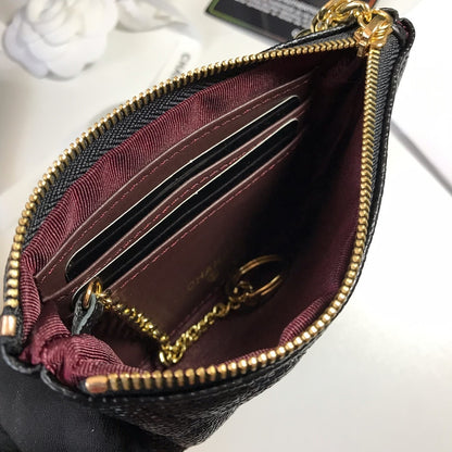 Quilted black leather coin purse with CC logo and gold-tone metal details