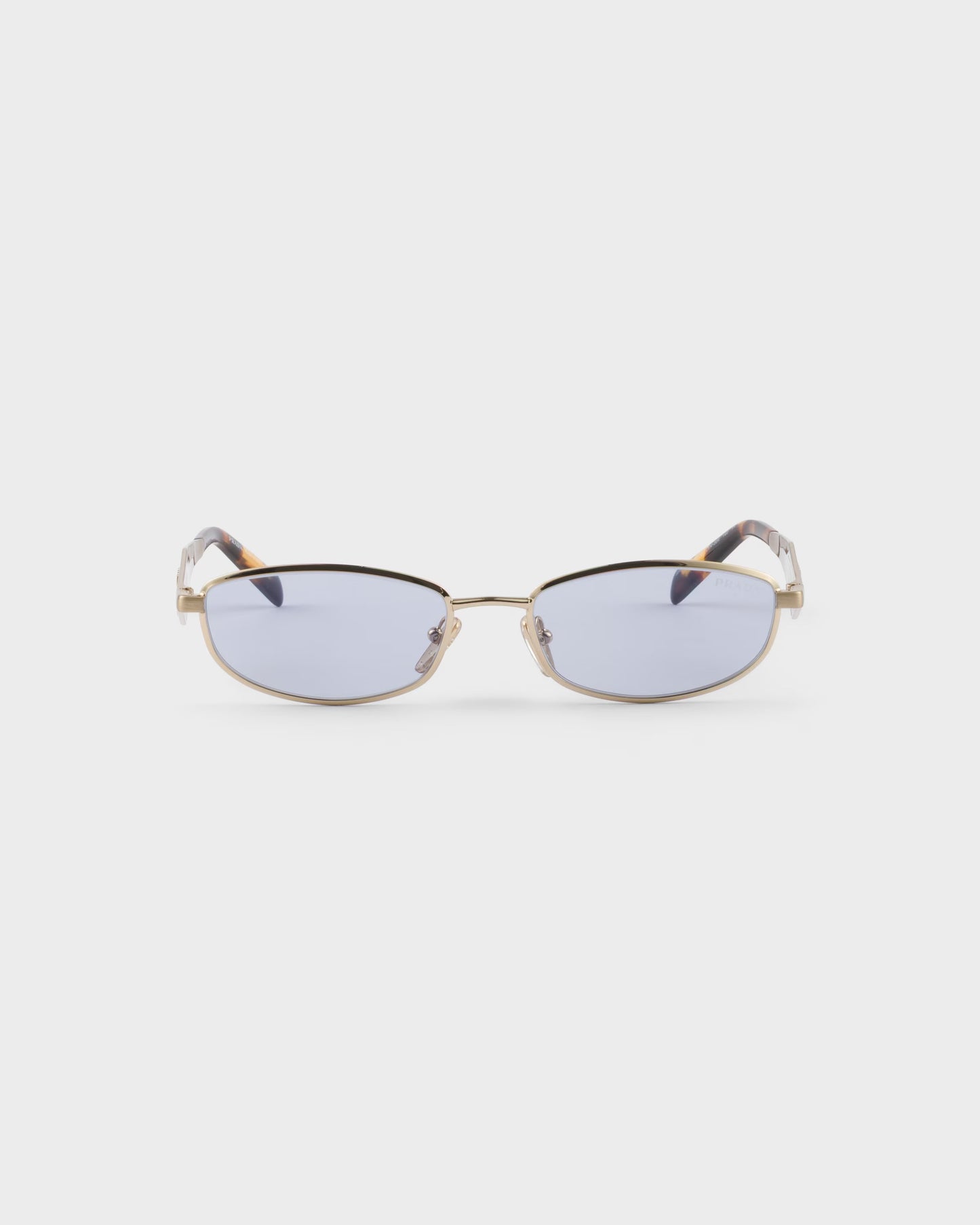 Pale gold acetate oval sunglasses with ultraviolet lenses