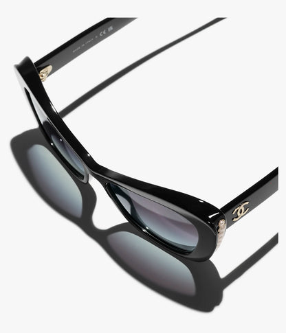 Cat-Eye-Sonnenbrille aus Acetat, schwarzem Perlmuttglas und Gold mit grau verlaufenden Gläsern
