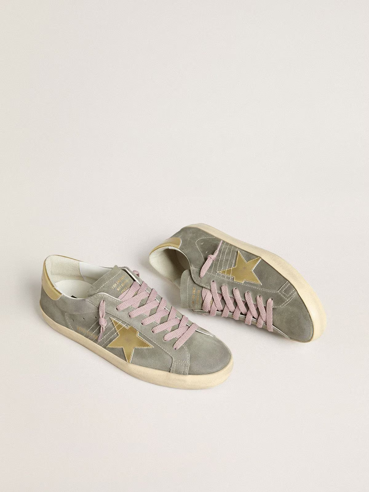 Grey suede with star and heel in golden metallic leather