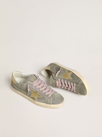 Grey suede with star and heel in golden metallic leather