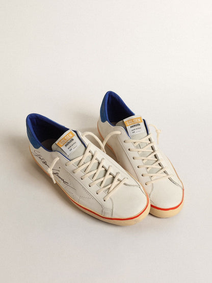 Superstar with perforated star and blue suede heel tab