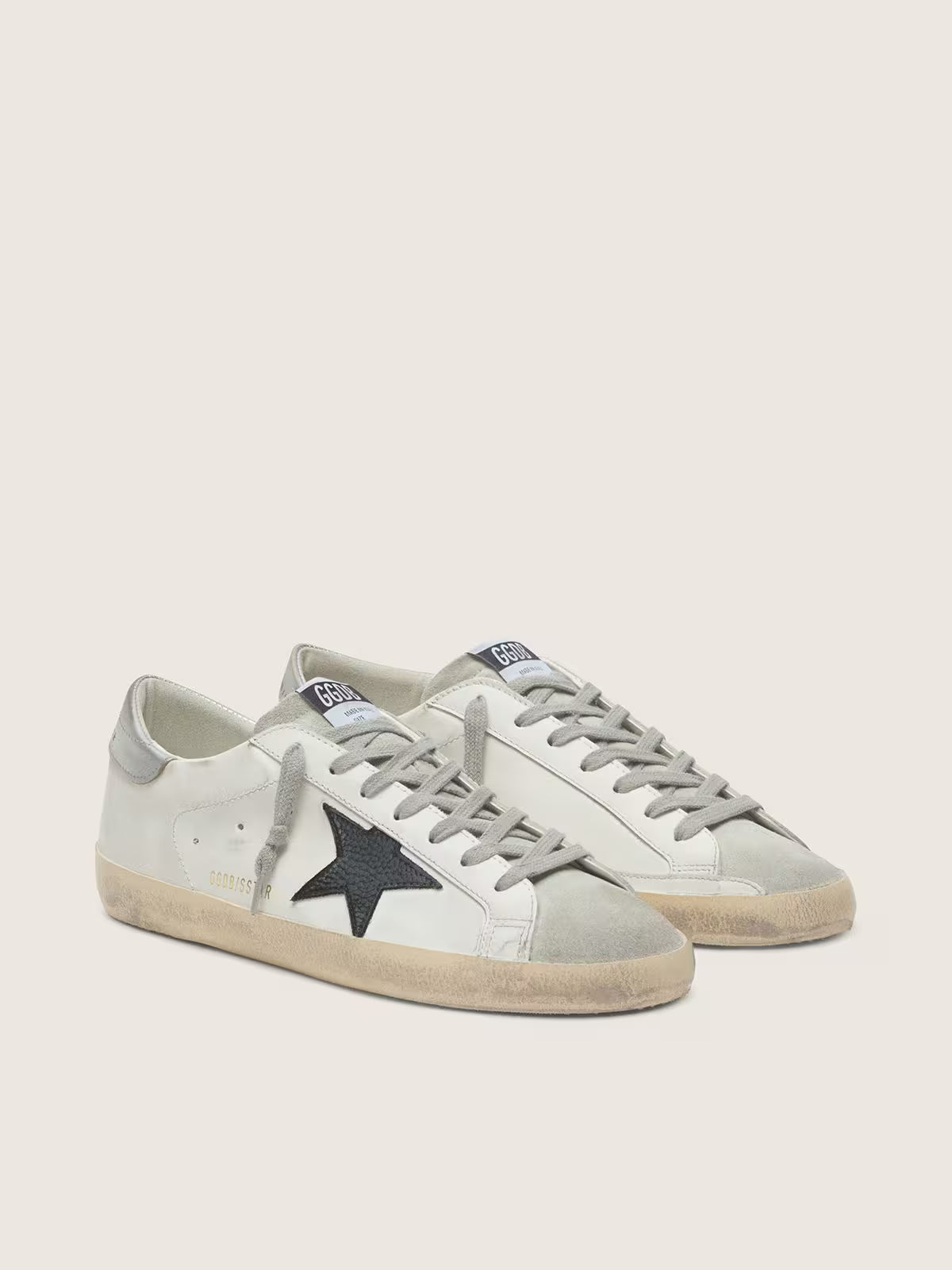 White leather with a black nubuck leather star and silver metallic leather heel