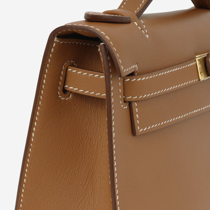 Kelly Pochette – Swift leather in gold