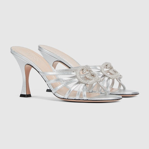Women's heeled slider sandals with GG criss-cross straps and crystals in silver leather
