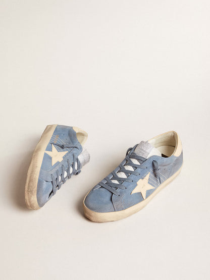Azure blue suede with a star and heel in beige leather