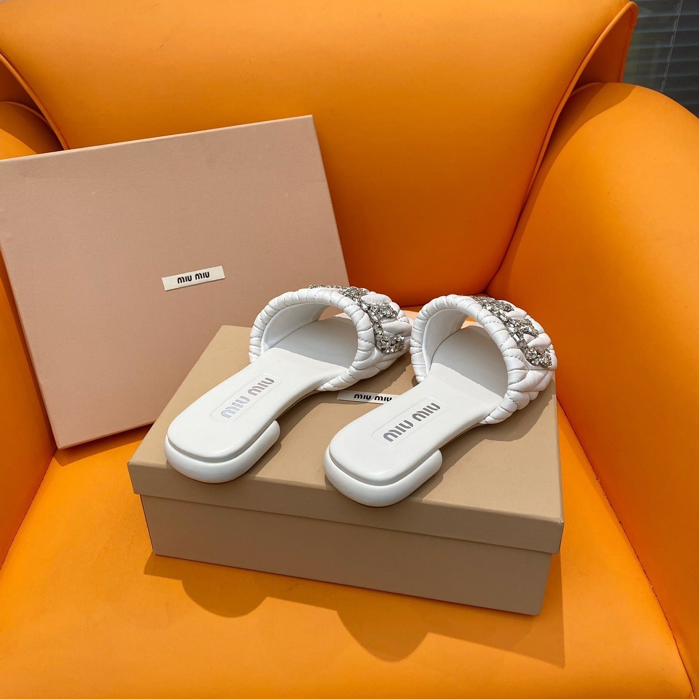 Sandals in quilted white leather embellished with crystals