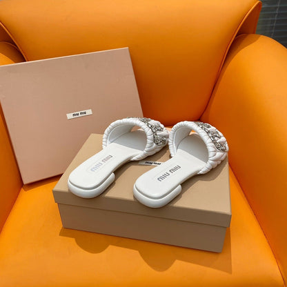 Sandals in quilted white leather embellished with crystals