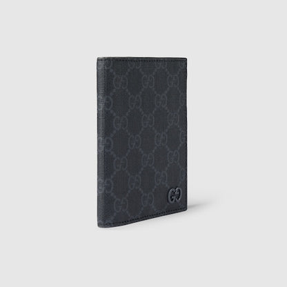 GG passport cover with grey lining made of black GG Supreme fabric