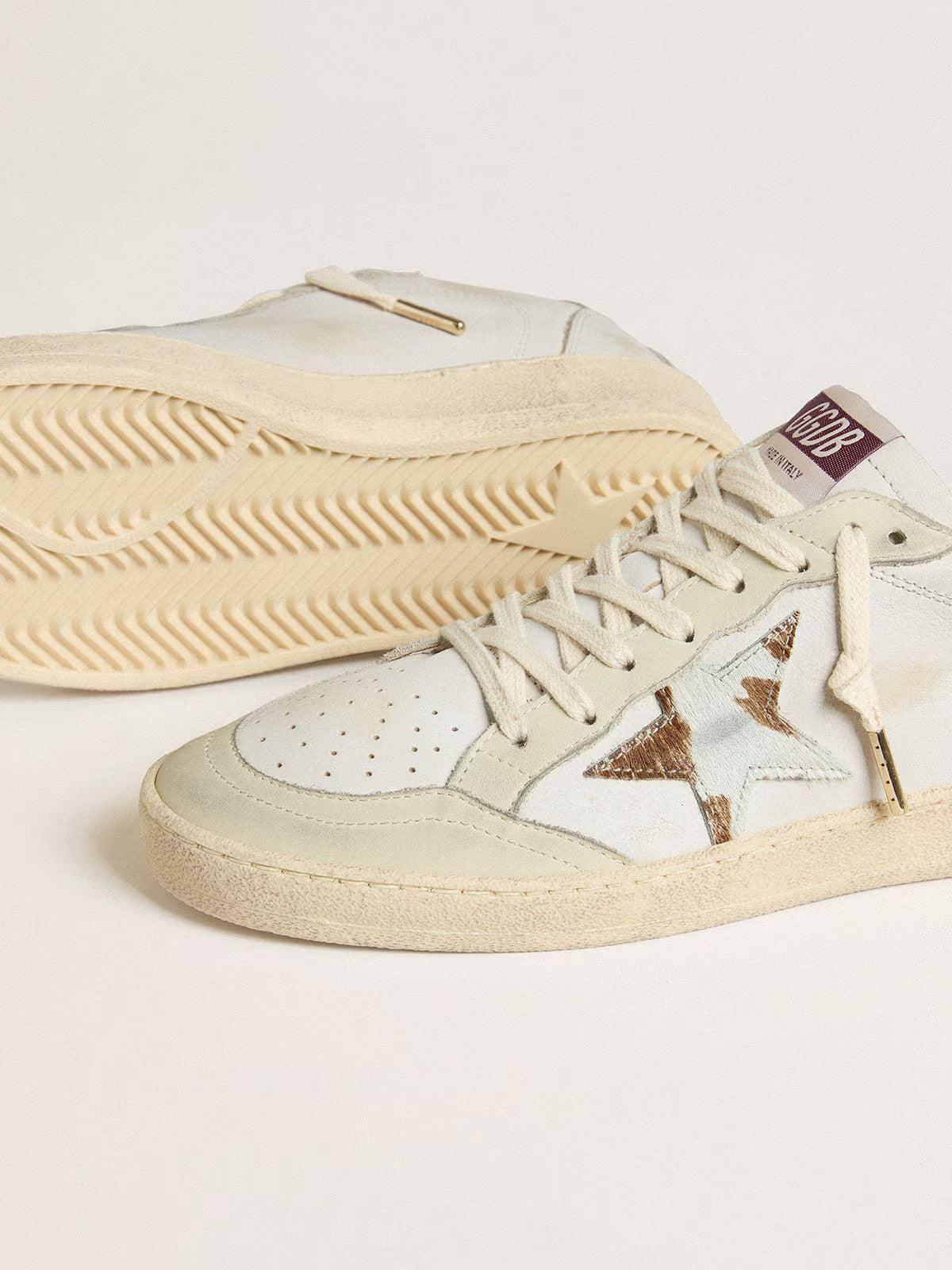 Star in Cavallino leather with a polka dot design and tobacco-brown leather at the heel