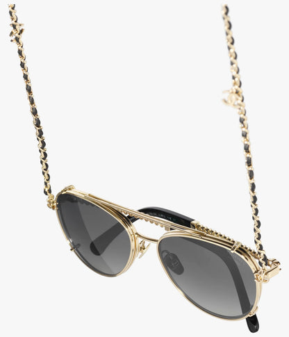 Pilot-Sonnenbrille aus hellgoldfarbenem Metall und Kalbsleder mit grauen Gläsern