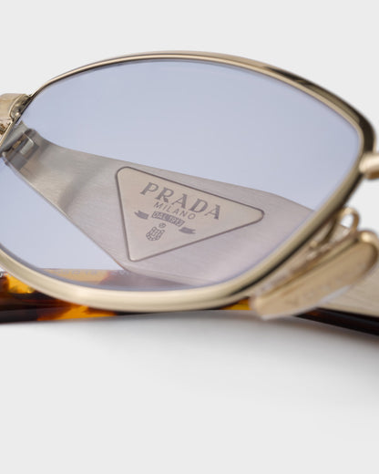 Pale gold acetate oval sunglasses with ultraviolet lenses