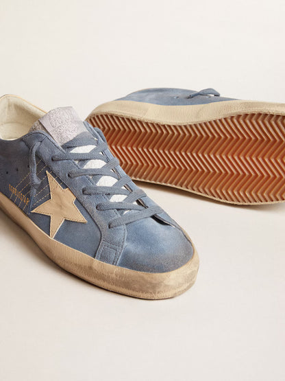 Azure blue suede with a star and heel in beige leather