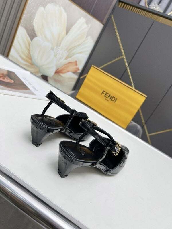 Black leather kitten-heel pumps with gold FF buckles
