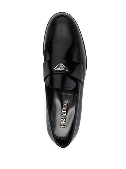 Leather moccasins with enameled triangle logo