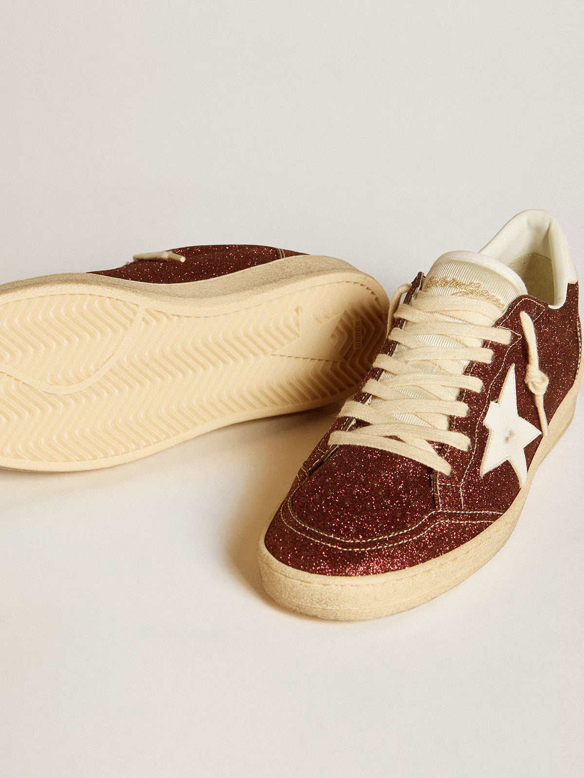 Bordeaux glitter with a star and white leather heel counter