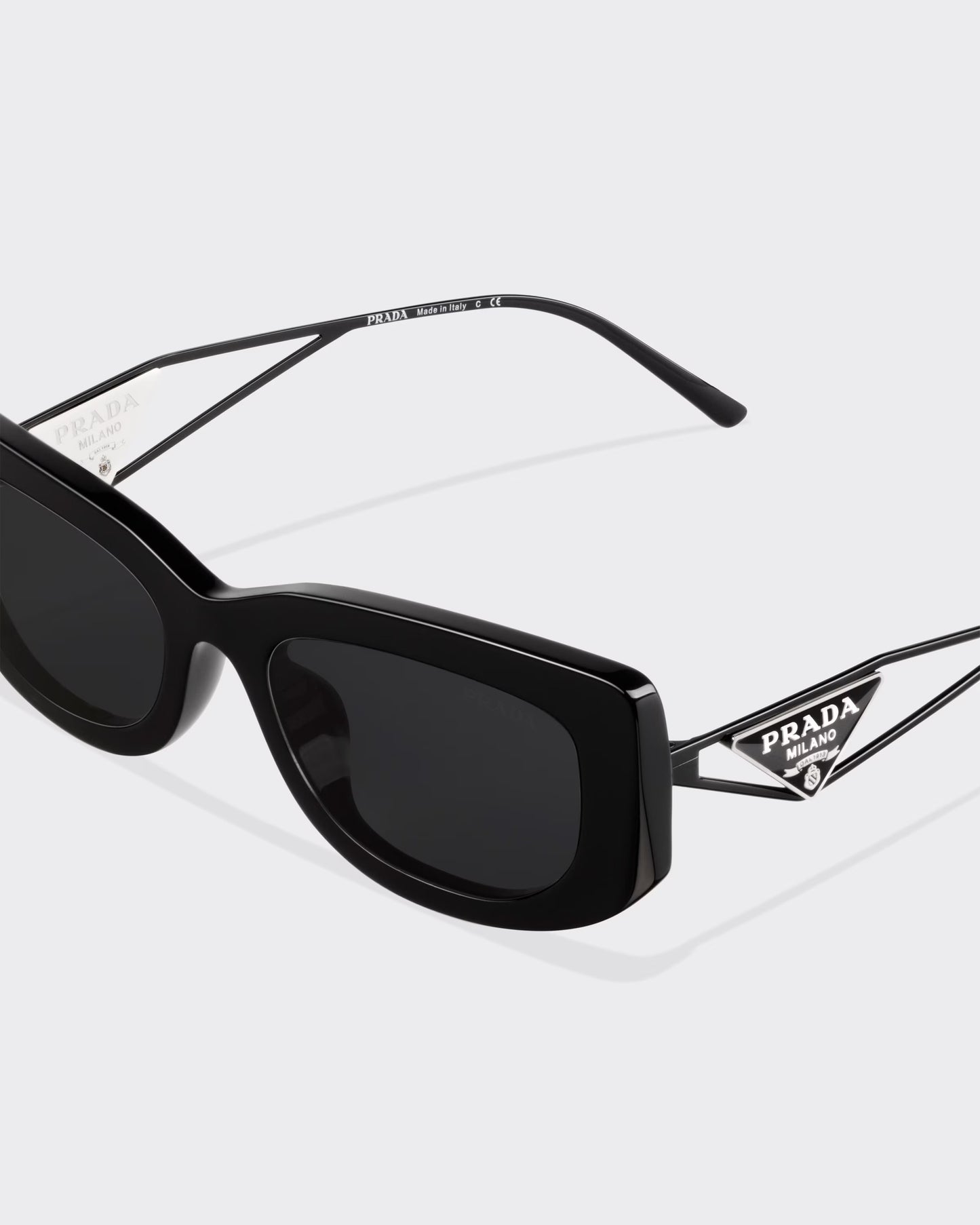 Sunglasses with triangle logo and slate-colored lenses