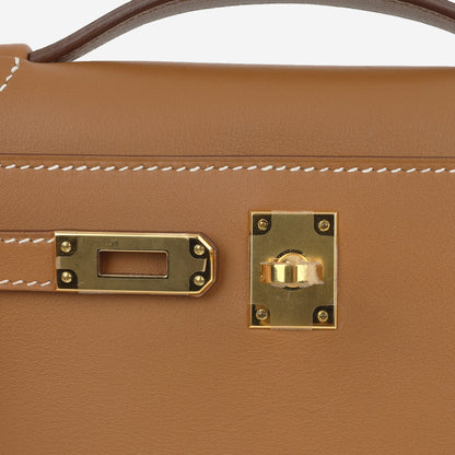 Kelly Pochette – Swift leather in gold