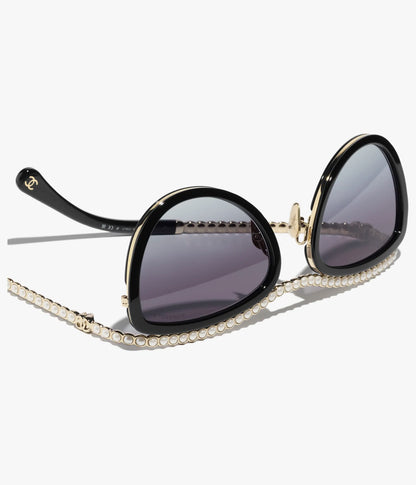 Cat-Eye-Sonnenbrille aus Acetat mit schwarzen und grauen Gläsern sowie Kunstperlen