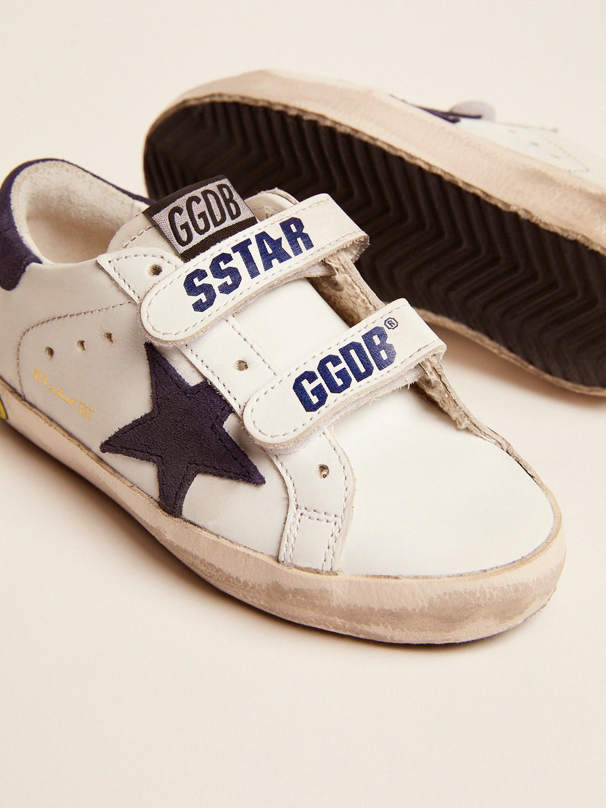 Old School Young in white leather with star and heel detail in blue suede
